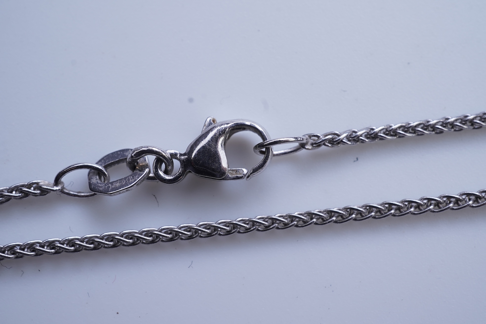 A cultured pearl and diamond pendant